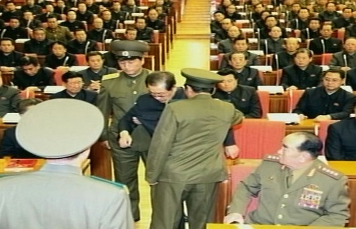 In an image taken from footage shown by North Korea's KCTV and released by South Korea's Yonhap news agency on December 9, 2013, Jang Song-Thaek is reportedly being dragged away from his chair by two police officials during a meeting in Pyongyang. North Korea confirmed on December 9 that the powerful uncle of Kim Jong-Un, the nation's leader, had been removed. New reports from North Korea say that Jang has been executed.