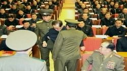 This undated image grab taken from footage shown by North Korea's KCTV and released by South Korea's Yonhap news agency on December 9, 2013, shows Jang Song-Thaek (C) reportedly being dragged out from his chair by two police officials during a meeting in Pyongyang. North Korea confirmed on December 9 that the powerful uncle of young leader Kim Jong-Un has been purged, with state TV airing humiliating images of Jang Song-Thaek being dragged away by uniformed officers.  REPUBLIC OF KOREA OUT  NO ARCHIVES  NO INTERNET    RESTRICTED TO SUBSCRIPTION USE     AFP PHOTO/YONHAPYONHAP/AFP/Getty Images
