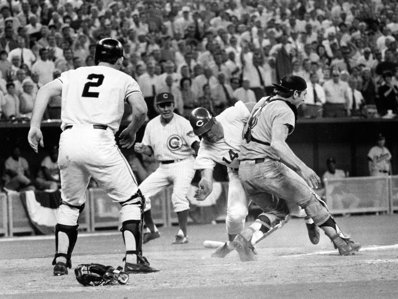 Cincinnati Reds' Pete Rose slams into Cleveland Indians' catcher Ray Fosse to score a controversial game-winning run for the National League team in the 12th inning of the 1970 All-Star game in Cincinnati. Fosse suffered a fractured shoulder in the collision.