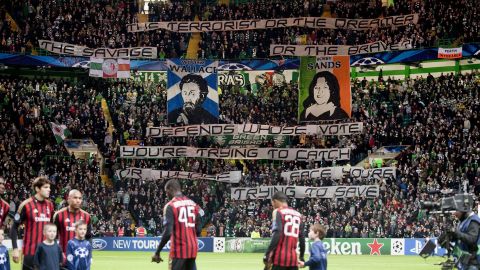 Celtic's Green Brigade fans raise banners before a game against AC Milan. The result: A fine of 50,000 euros and angry executives.