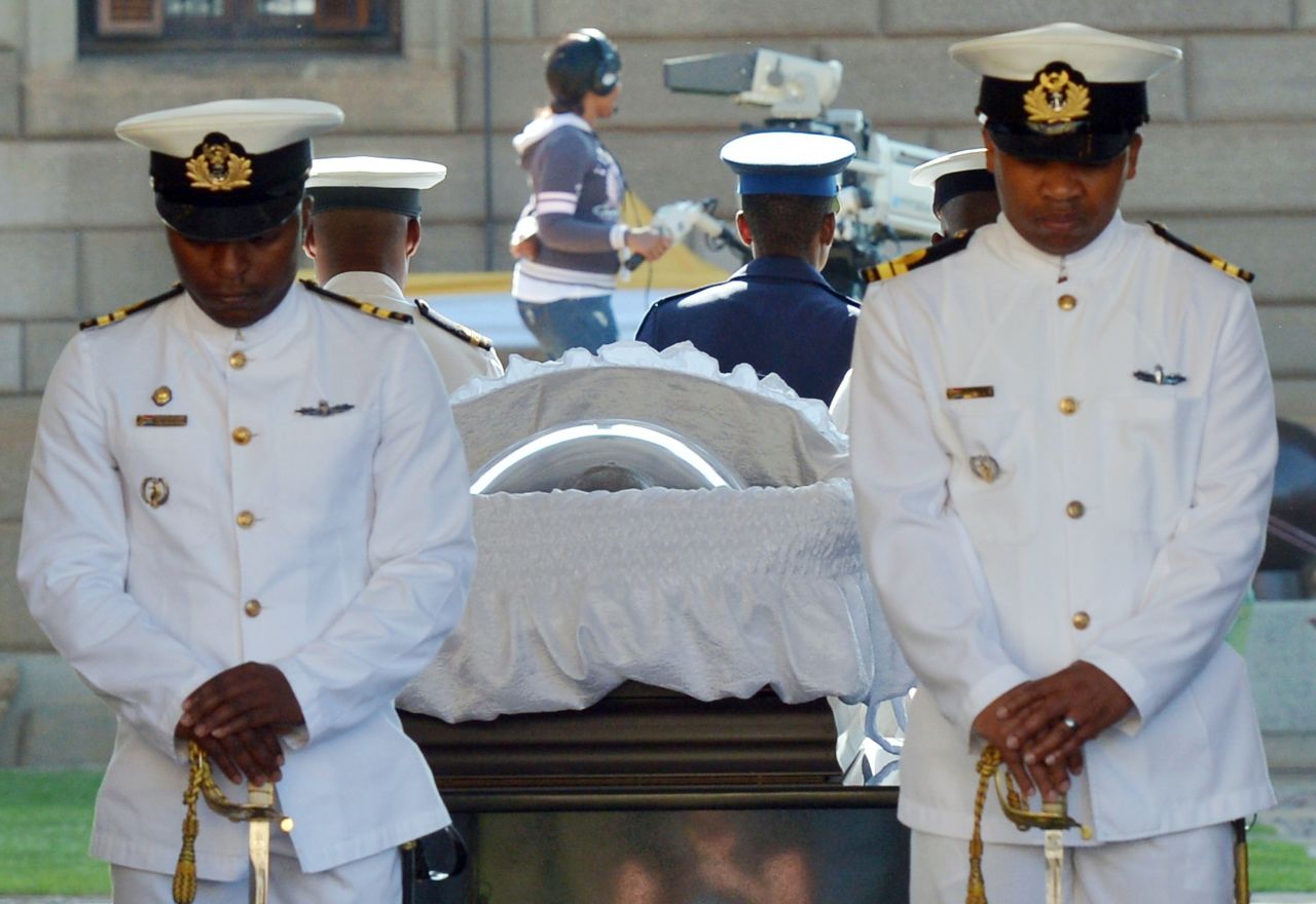 South African Naval personnel stand guard around Mandela's casket as he is carried to the Union Buildings on the final day of his lying in state on December 13.