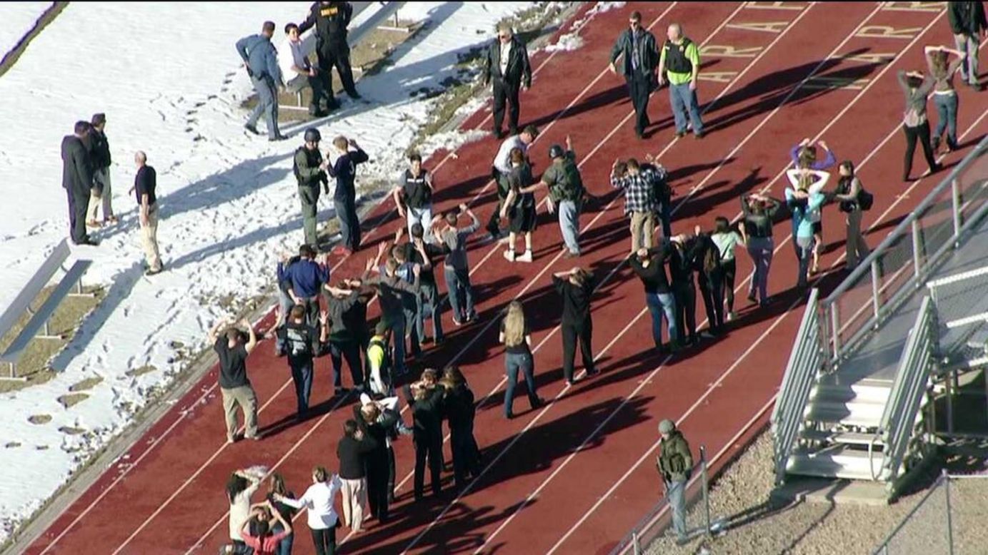 Students from Arapahoe High School gather at the school's track.