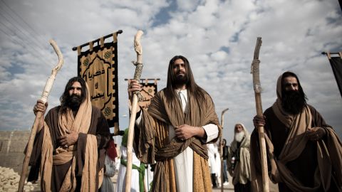 An Iranian Muslim Shiite man, acting as Jesus, center, takes part in the annual religious performance of "Taazieh" in the Iranian town of Noosh Abad on November 12, 2013. 