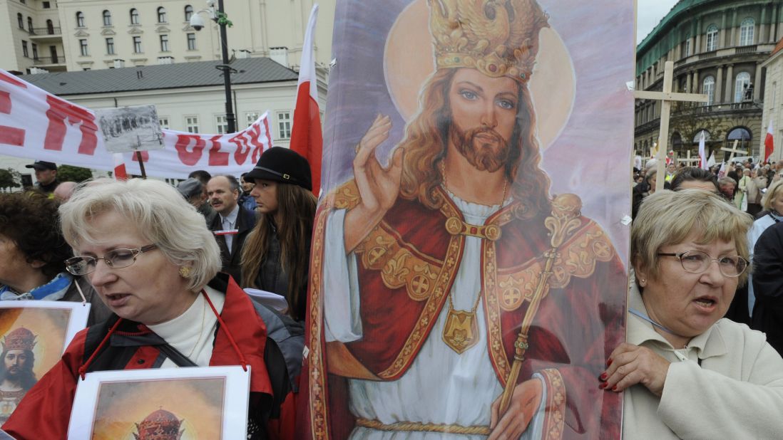 Women carry a religious painting as hundreds of Roman Catholics march through Warsaw's downtown demanding more religion in social and political life in Poland on September 19, 2010. 