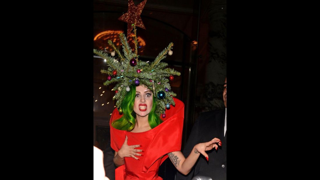 Pop singer Lady Gaga wears a real Christmas tree as a hat while returning to her hotel following the Jingle Bell Ball at London's O2 Arena on December 9.