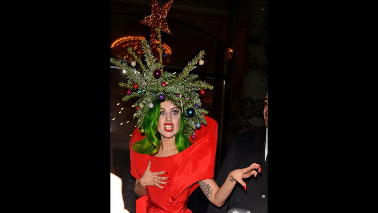 Pop singer Lady Gaga wears a real Christmas tree as a hat while returning to her hotel following the Jingle Bell Ball at London's O2 Arena on December 9.