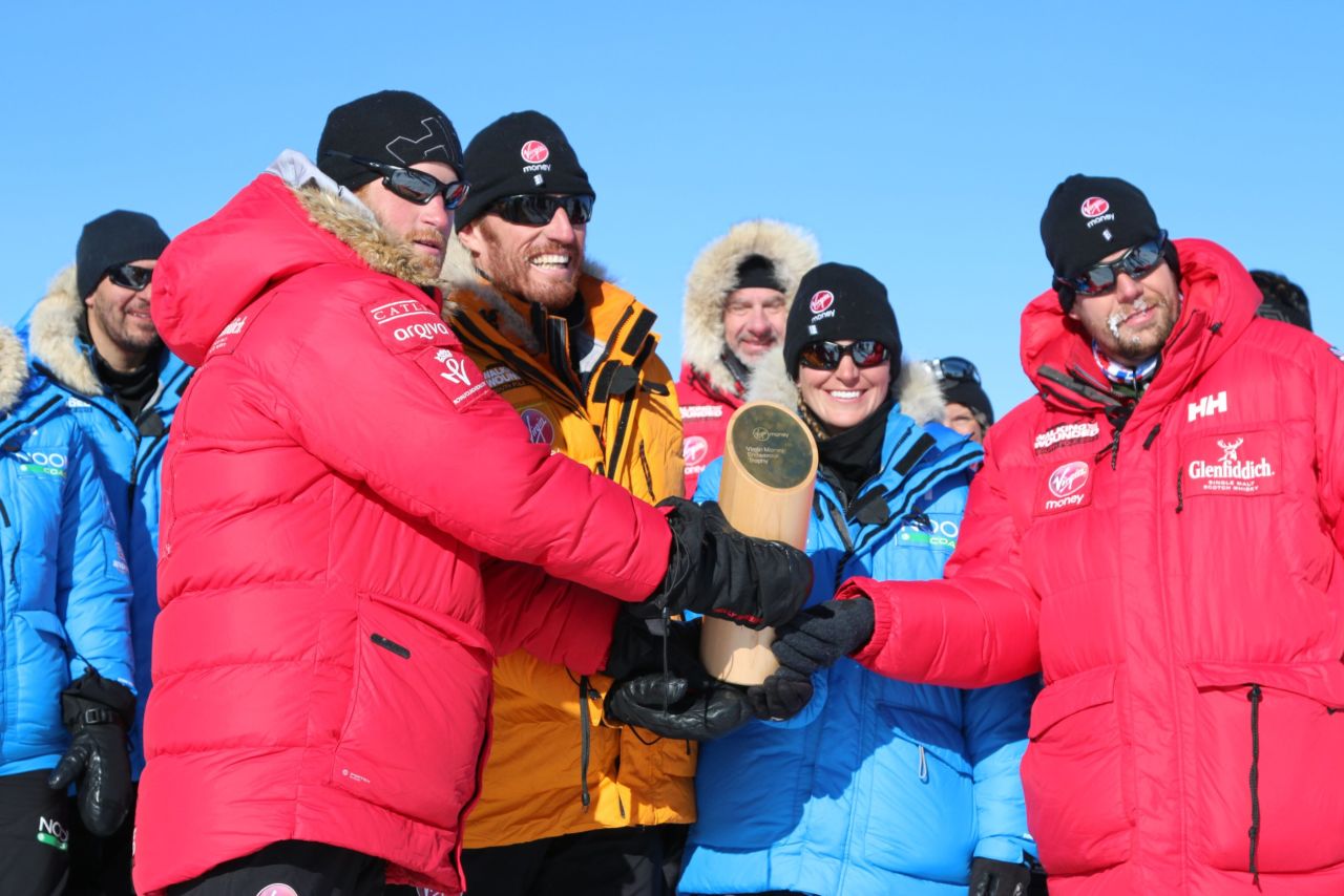 Prince Harry, left, with fellow adventurers after reaching the South Pole.