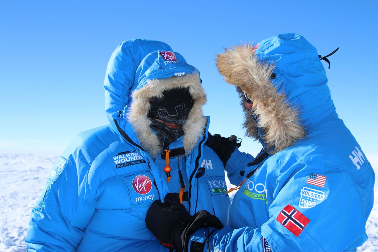 Two unidentified members of Team U.S. chat on the first day of the 200-mile expedition to the South Pole alongside wounded service personnel. Team U.S. is one of three teams competing in the trek to raise money for Walking With The Wounded.  