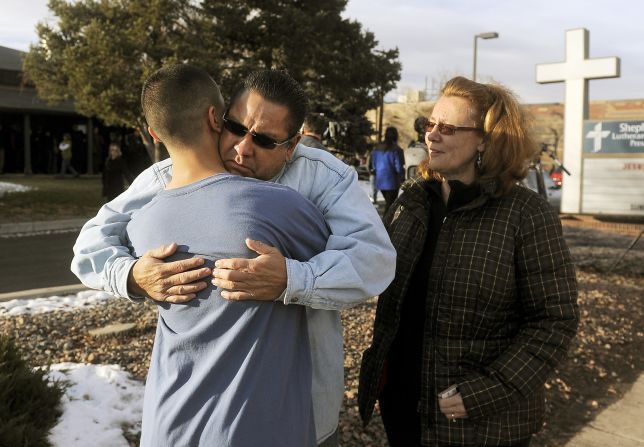 Ruben Allen hugs his son Alex Allen, 17, after being evacuated from the school 