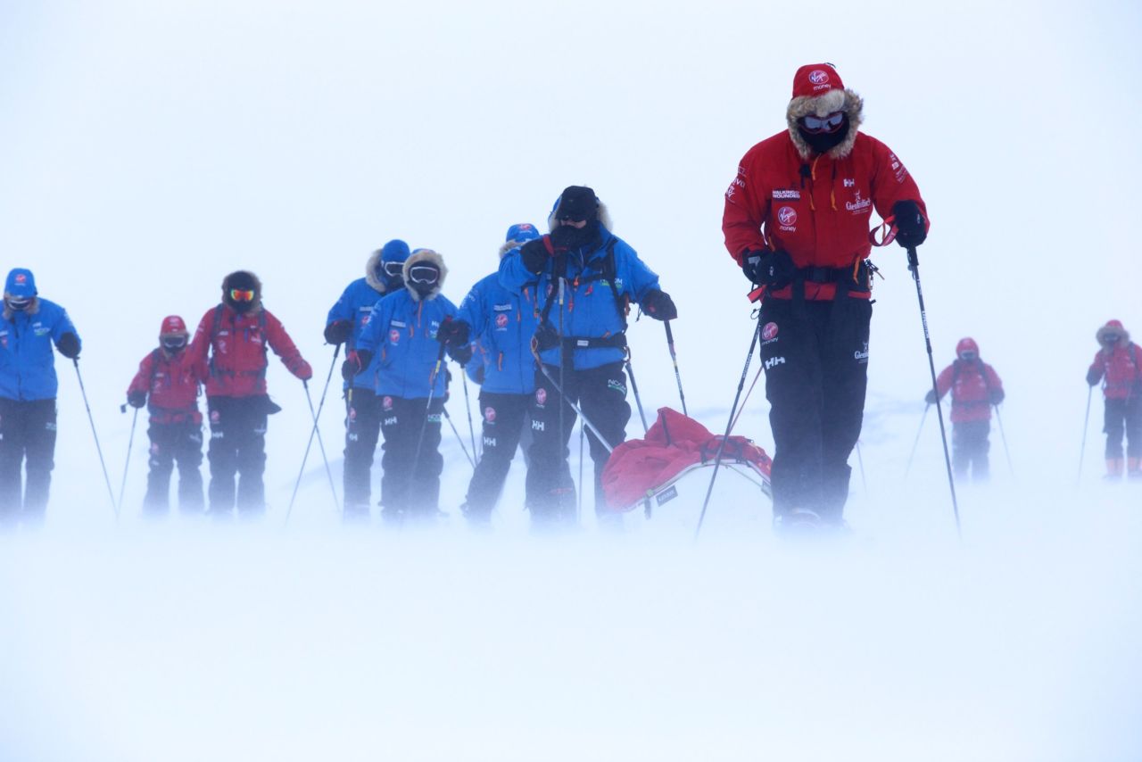 Prince Harry pulls the pulk that guides U.S. team member Ivan Castro, who is blind, as he takes part in ski training near Novo.
