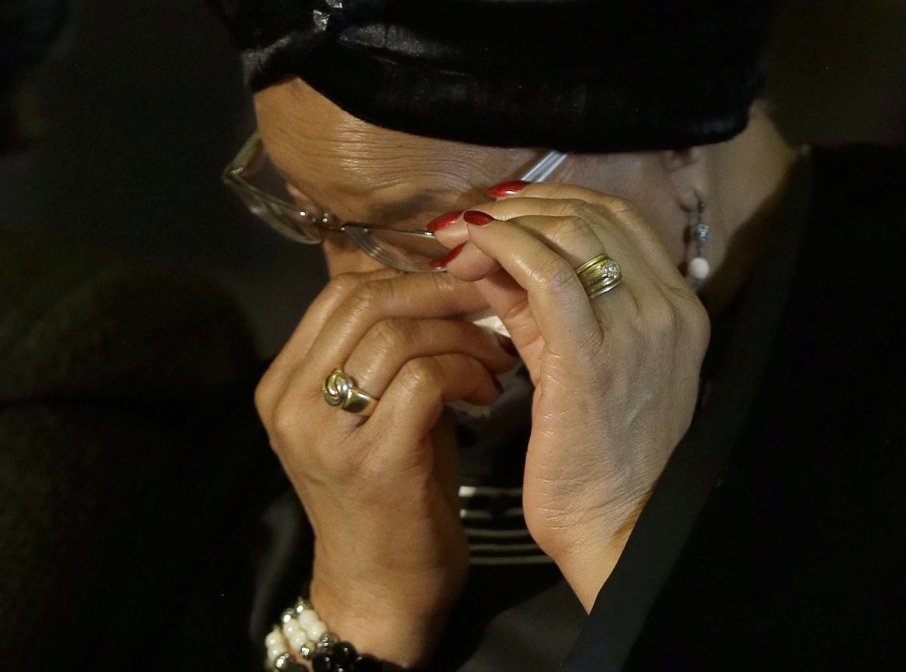 Mandela's widow, Graca Machel, wipes her eyes during the farewell ceremony for her husband.