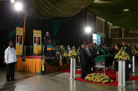 South African President Jacob Zuma speaks during an African National Congress-led alliance send-off ceremony at Waterkloof air base in Pretoria before the final journey of Mandela's body to his hometown of Qunu for burial.