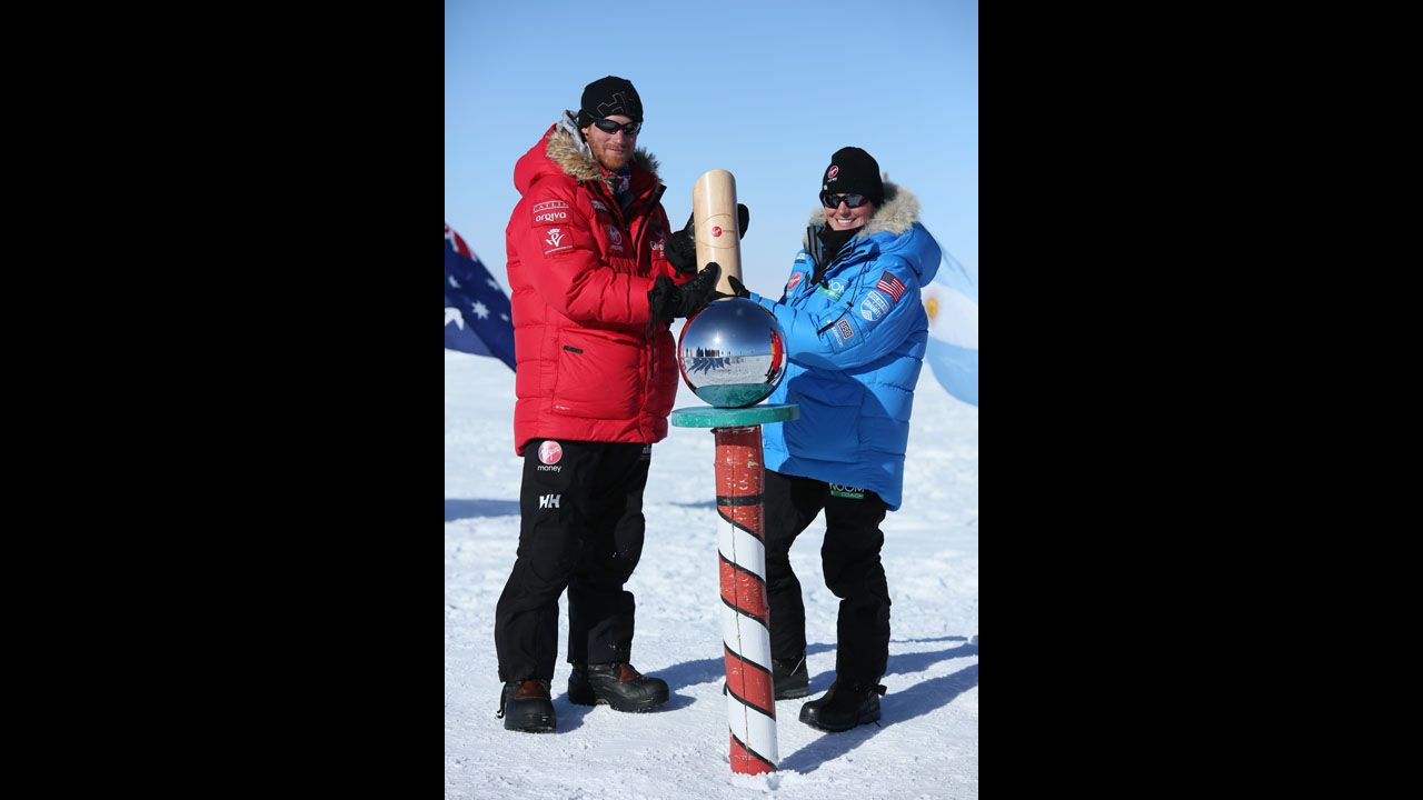 Prince Harry, left, and Margaux Mange of Team U.S. pose at the South Pole after more than three weeks pulling sleds across the frozen wastes of Antarctica. The group stood at the bottom of the world at midday. 