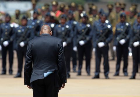President Jacob Zuma awaits the cortege of Mandela at the Waterkloof air base in Pretoria.