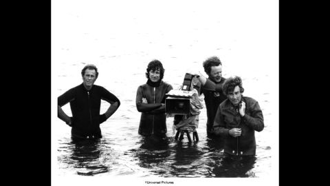 Spielberg, arms crossed, and his camera crew wade in water on the set of "Jaws" at Martha's Vineyard in Massachusetts. The 1975 film made $60 million in its first month, which in 2013 dollars would be equal to about $256 million. "Jaws" was the highest-grossing movie of all time until "Star Wars."