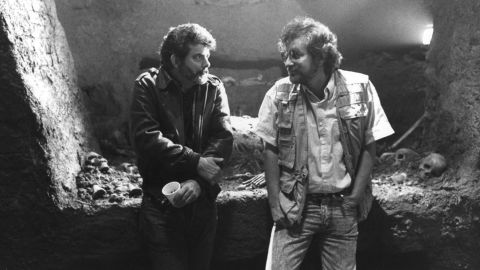 Executive producer George Lucas, left, and Spielberg confer on the set of the film "Indiana Jones and the Last Crusade" in 1989. The two influential filmmakers have worked on multiple movies together.