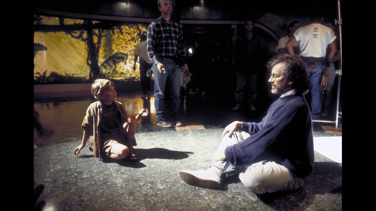 Spielberg sits with child actor Joseph Mazzello during the filming of "Jurassic Park" in 1993. The film, based on the science-fiction novel by Michael Crichton, is Spielberg's highest-grossing movie to date. It has made more than $914 million.