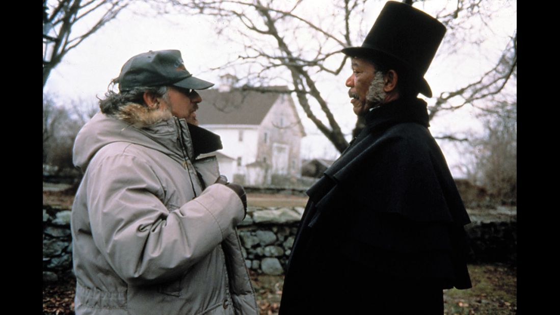 Spielberg appears on the set of the 1997 film "Amistad" with actor Morgan Freeman.