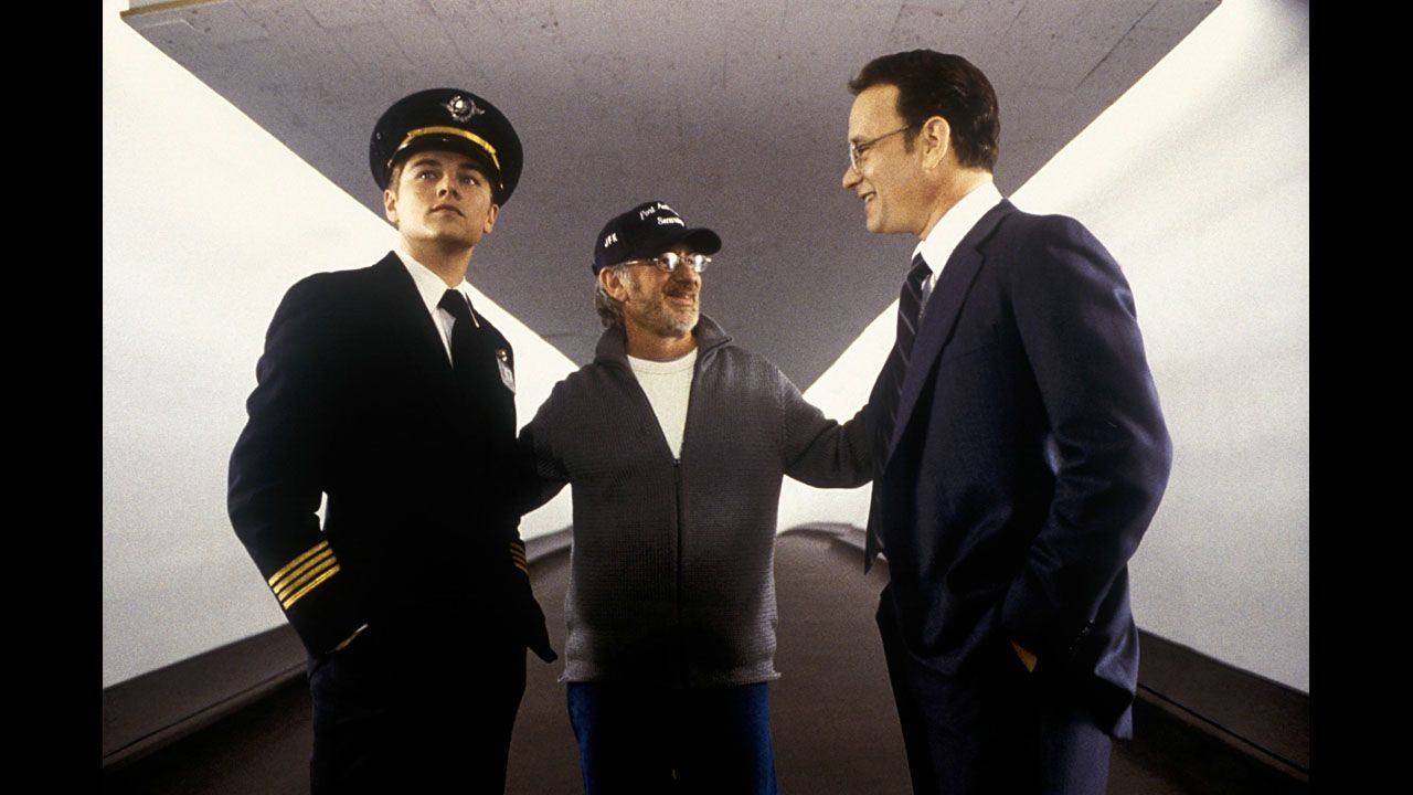 Spielberg, center, works with actors Leonardo DiCaprio, left, and Hanks on the set of "Catch Me if you Can" in 2002.