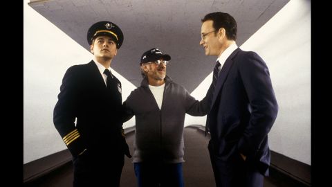 Spielberg, center, works with actors Leonardo DiCaprio, left, and Hanks on the set of "Catch Me if you Can" in 2002.