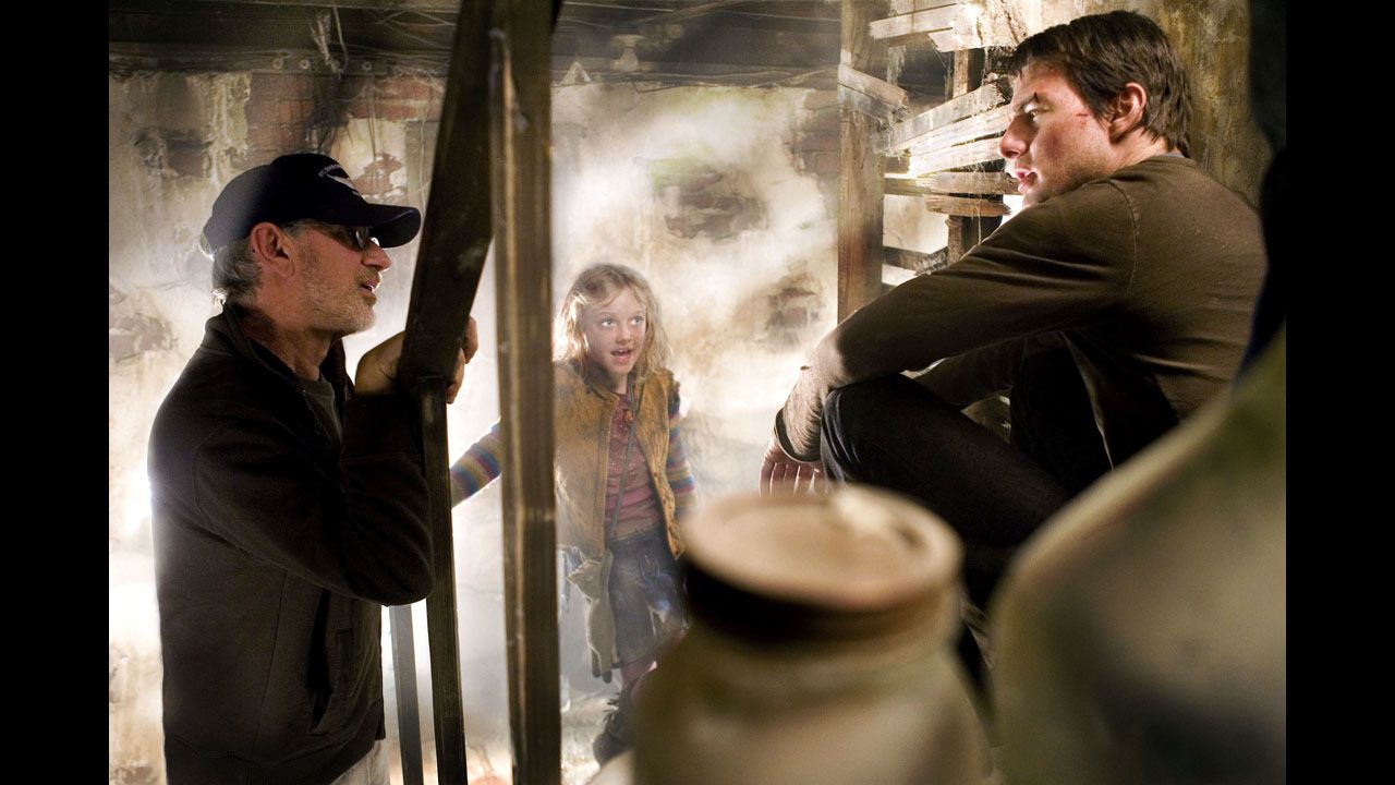 Spielberg, left, with Cruise and Dakota Fanning on the set of "War of the Worlds" in 2005. The movie recreated the legendary science-fiction novel by H.G. Wells.