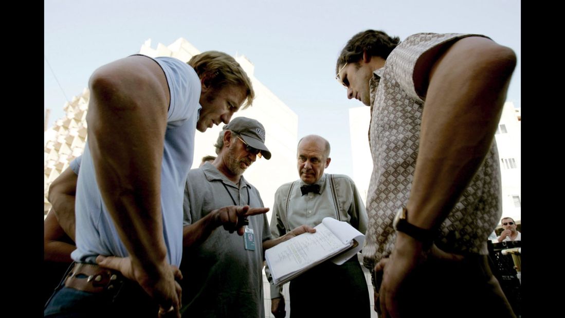 Spielberg, second from left, talks with actors Daniel Craig, Hanns Zischler and Eric Bana on the set of "Munich" in 2005. The movie is based on the hostage crisis that took place during the 1972 Munich Olympics.