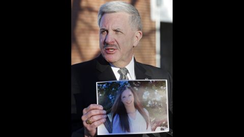 Arapahoe County Sheriff Grayson Robinson holds a picture of Davis at a press conference on Saturday, December 14, after identifying her as the victim of the shooting at Arapahoe High School the day before. 