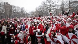 Revelers dressed as Santa Claus pose for a picture at Tompkins Square Park to take part during the annual SantaCon bar crawl event on Saturday, December 14 in New York City.