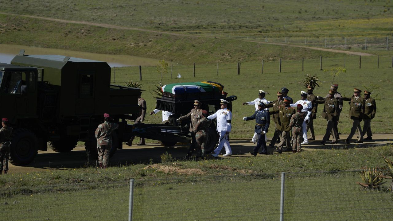 Mandela's casket is escorted to the funeral ceremony on December 15.