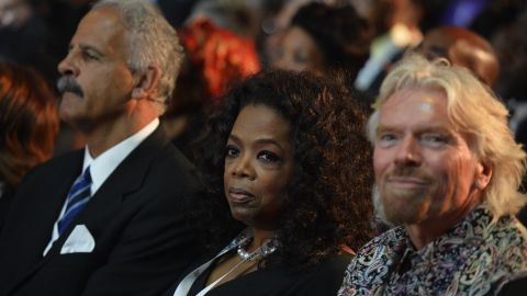 Oprah Winfrey and Richard Branson attend the funeral ceremony.