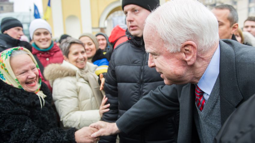 U.S. Senator John McCain (R) shakes hands with a woman on Independence Square in Kiev on December 15, during mass rally of the Ukrainian opposition. McCain told more than 200,000 EU supporters rallying in the Ukrainian capital Kiev in a fresh show of force against President Viktor Yanukovych after his failure to sign a key EU agreement, that Washington backed their desire for European integration.