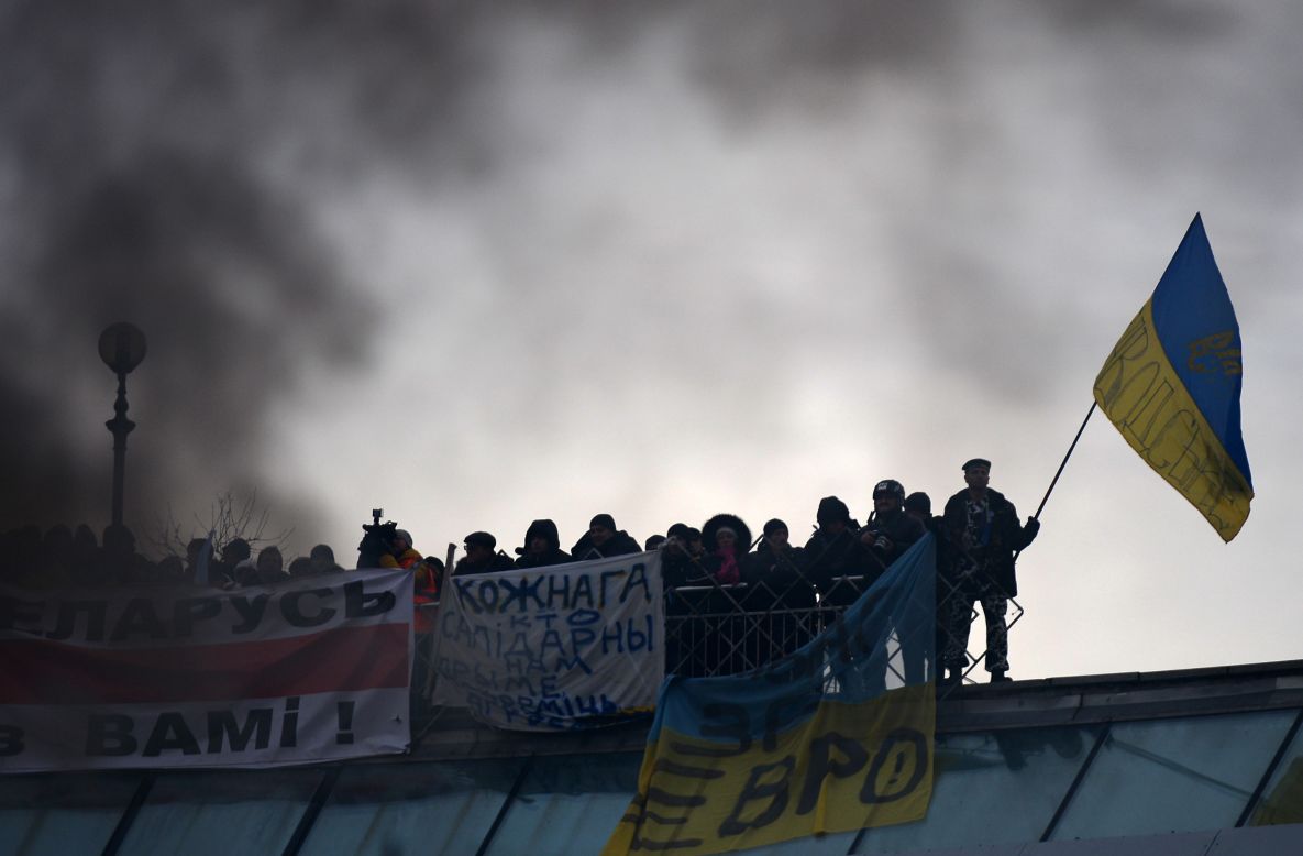 Smoke rises as Ukrainian protesters continue their anti-government demonstrations in Independence Square on December 15.