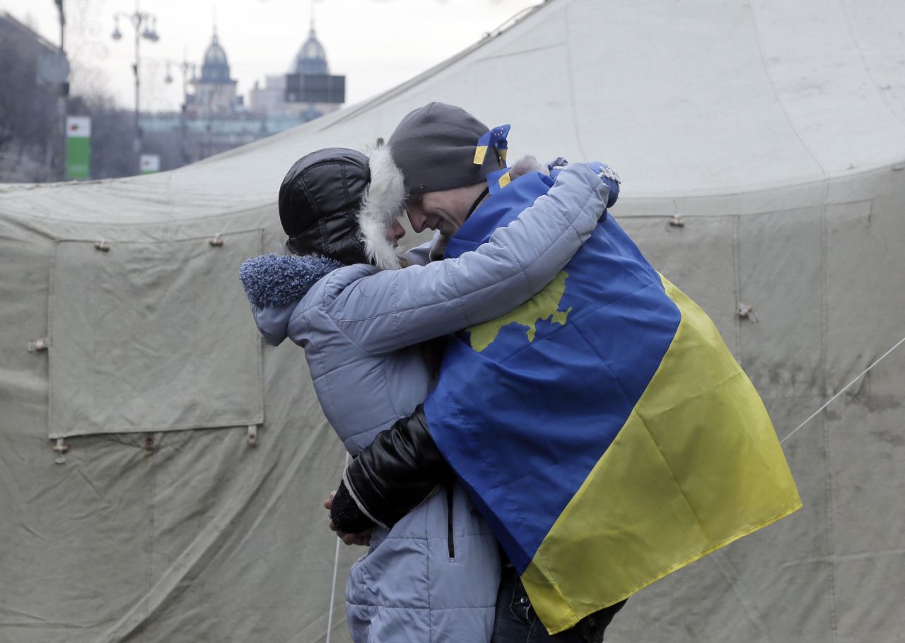 A couple of pro-EU activists share a tender moment at a tent camp in Kiev on December 15.