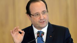 French President Francois Hollande speaks next to Brazilian President Dilma Rousseff (out of frame) during an agreements ceremony at Planalto Palace in Brasilia on December 12, 2013. Hollande is on two-day official visit to Brazil.