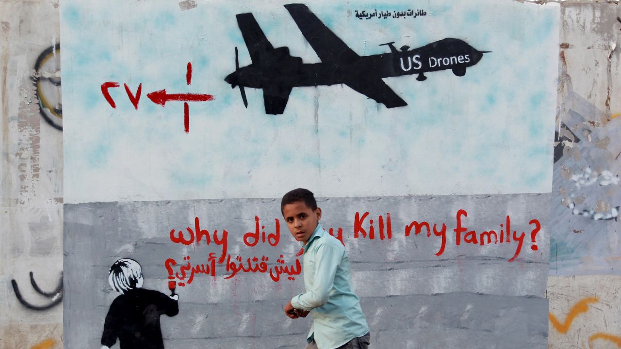 A Yemeni boy walks past a mural depicting a U.S. drone on December 13 in the capital Sanaa.