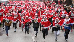 Participants leave the starting line in the 5th annual Michendorf Santa Run (Michendorfer Nikolauslauf) on December 8, 2013 in Michendorf, Germany. Over 900 people took part in this year's races, which included one for children and one for adults. 