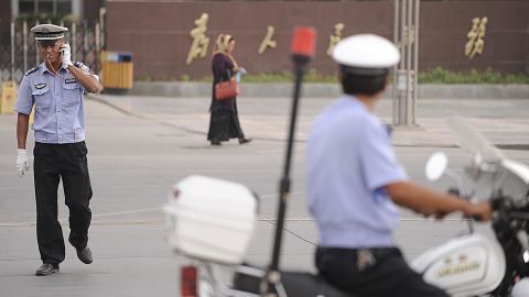Chinese policemen on patrol in this file photo taken in Kashgar, a city in China's volatile western region of Xinjiang.
