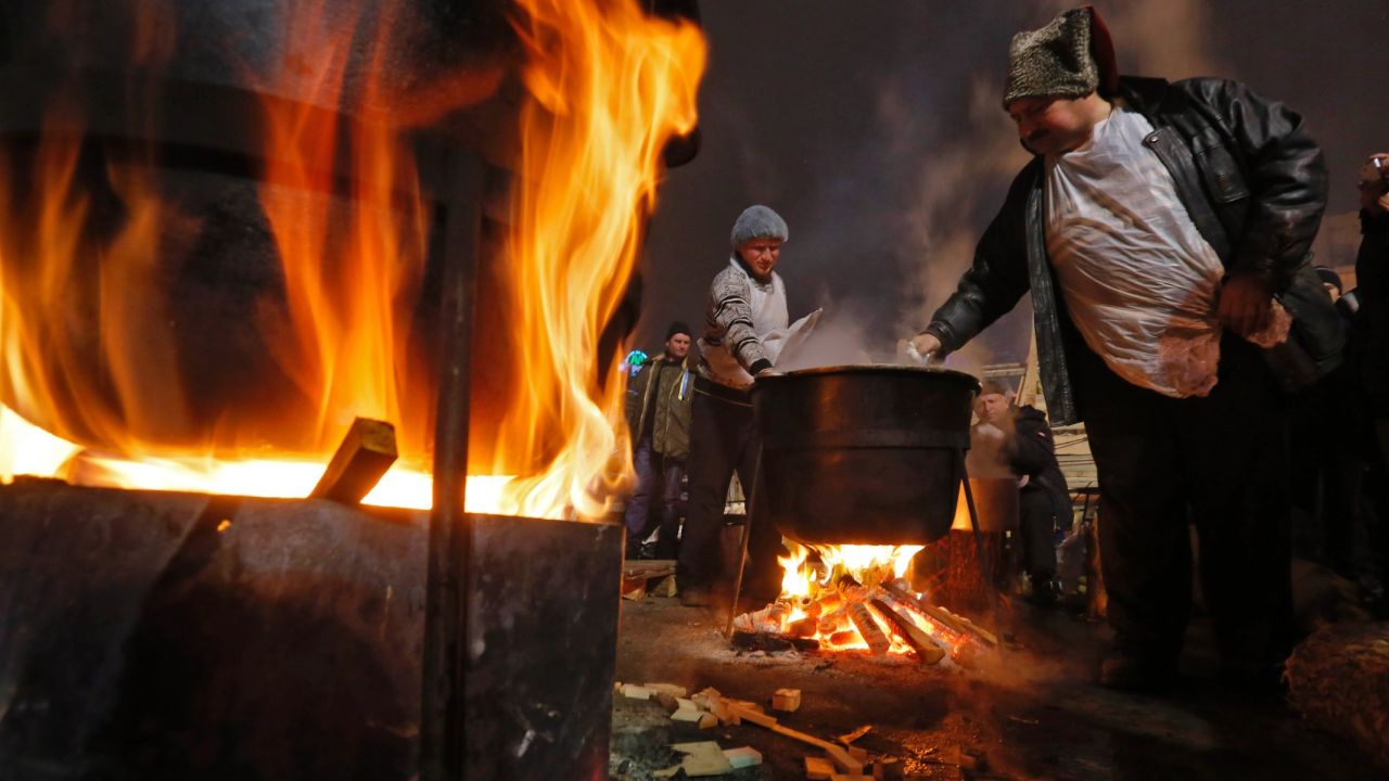 Pro-EU activists cook during a rally in Independence Square on Sunday, December 15.