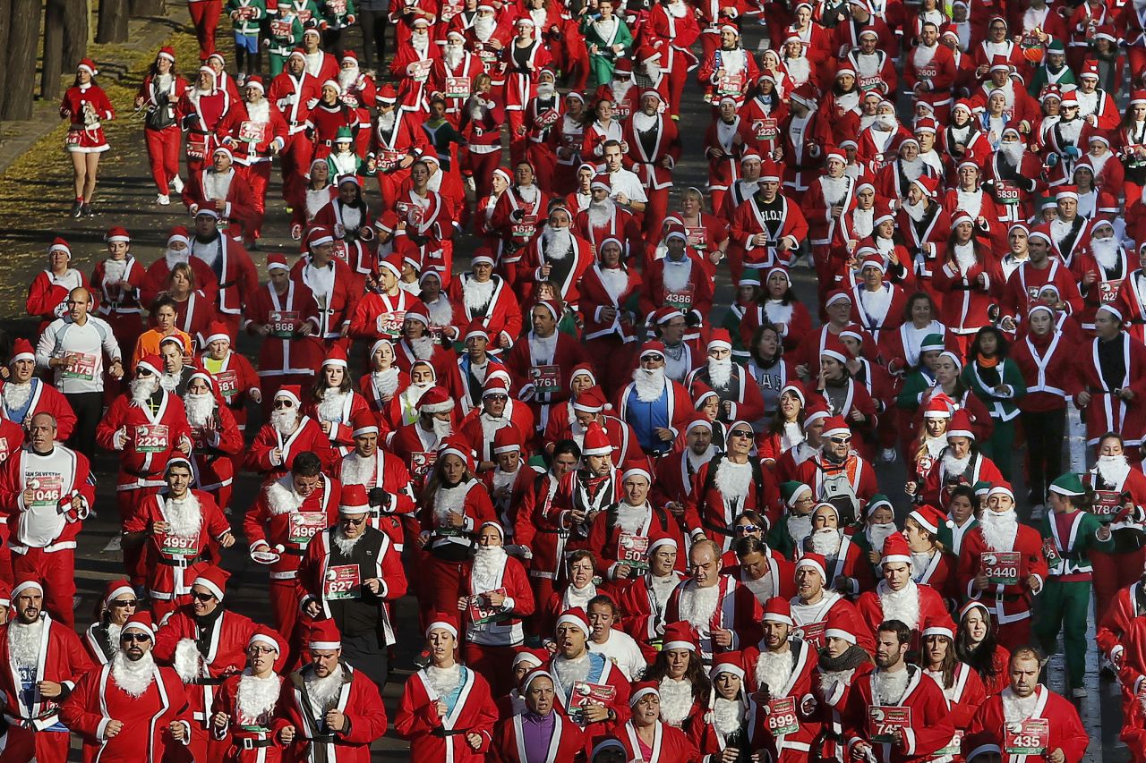 About 6,000 people dressed up as Santa Claus and his elves to run in the Madrid mini-marathon.