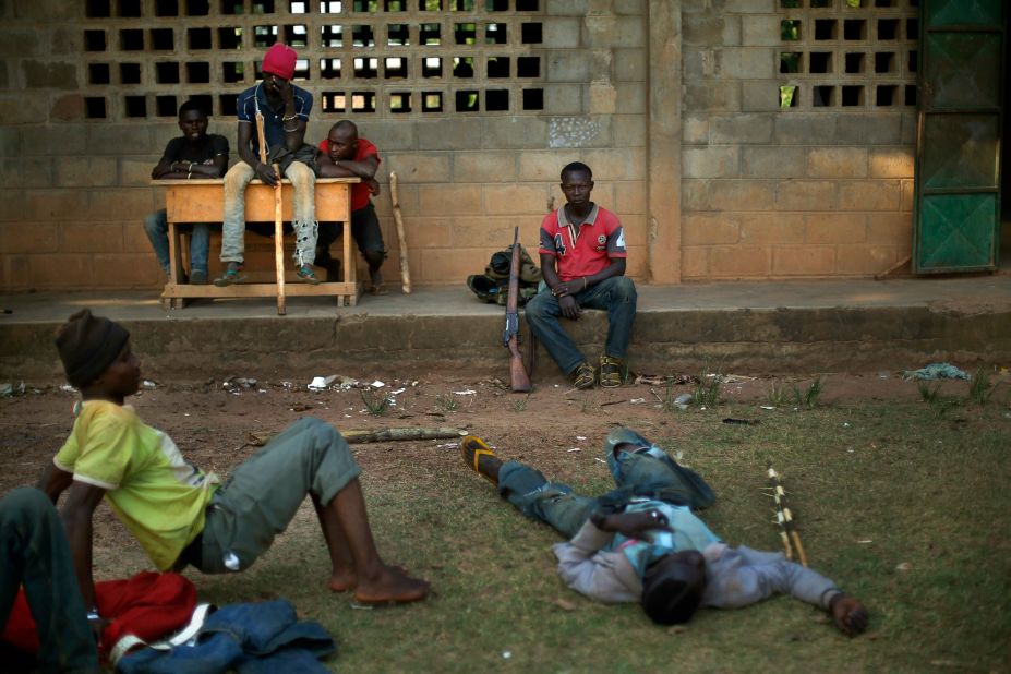 Former soldiers linked to Christian militiamen rest Sunday, December 15, in a camp set up in a Bangui school. Christian vigilante groups formed to battle Seleka, the predominantly Muslim coalition behind the March removal of President Francois Bozize.