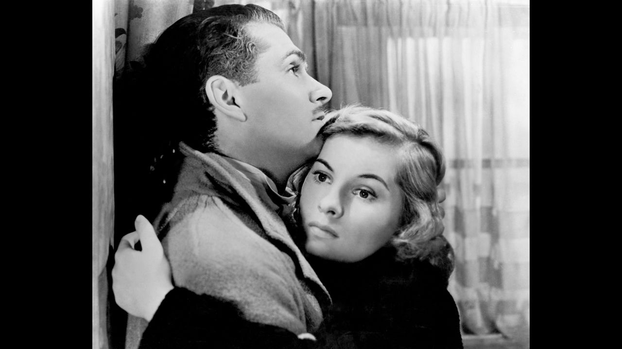 Fontaine and Laurence Olivier embrace in "Rebecca," a 1940 film directed by Alfred Hitchcock. For her role in "Rebecca," Fontaine earned her first Academy Award nomination for Best Actress.