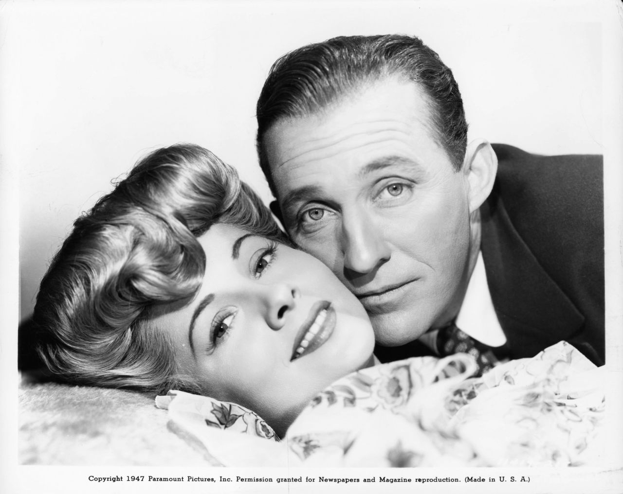 Fontaine and Bing Crosby, cheek to cheek in a scene from the film "The Emperor Waltz" in 1948.