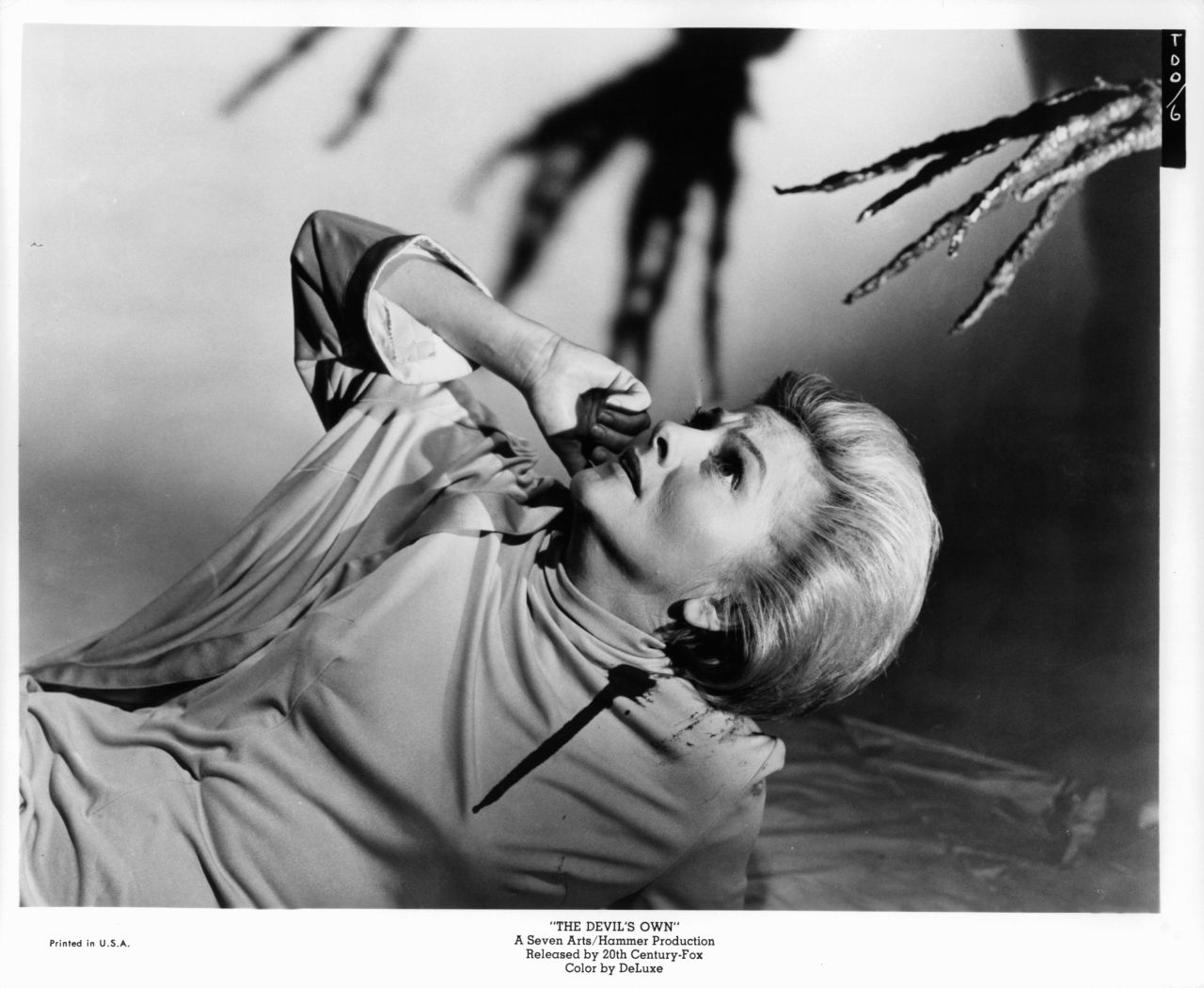 Fontaine appears scared of the branch-like hand coming at her in a scene from the 1966 film "The Devil's Own."