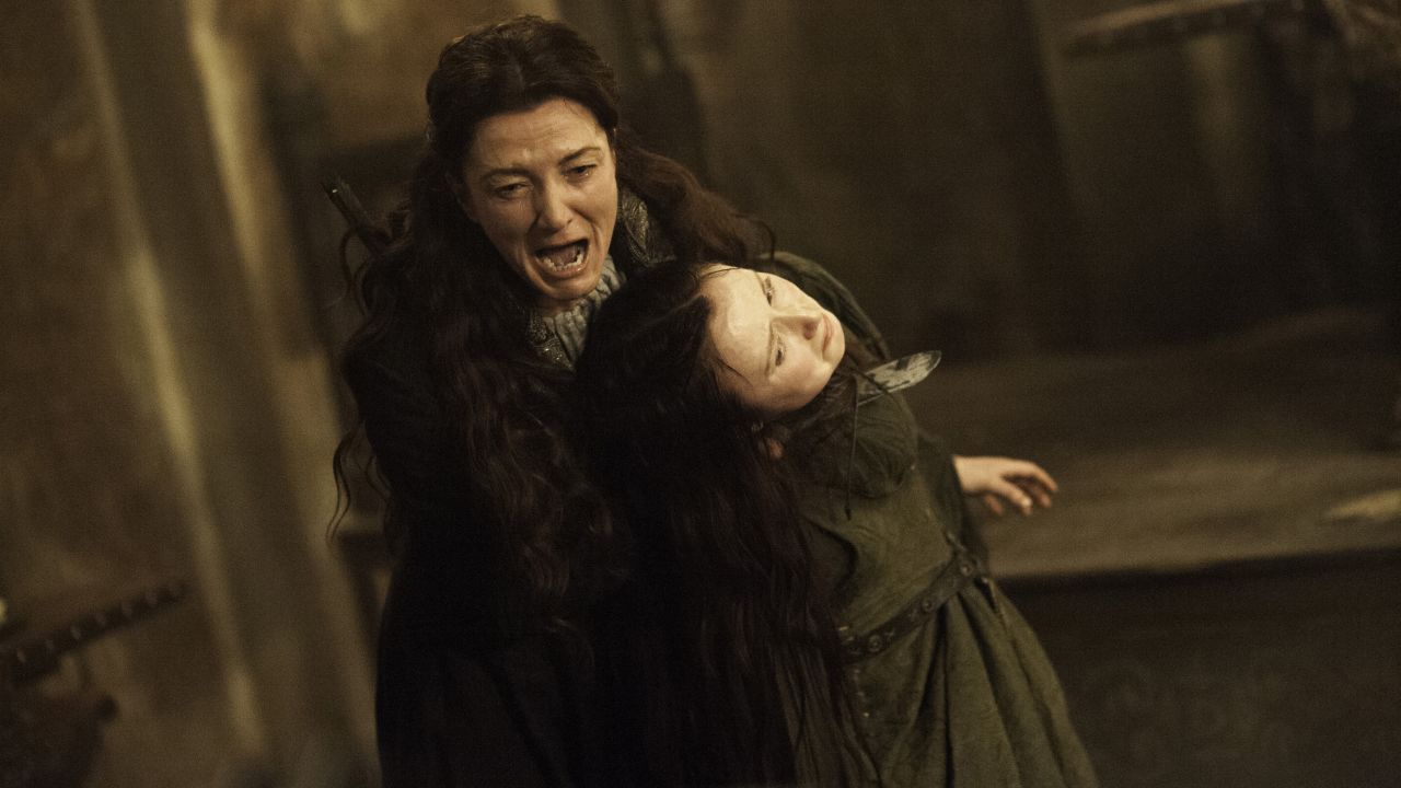 Catelyn Stark (Michelle Fairley) seizes Walder Frey's wife (Kelly Long) in an episode of  "Game of Thrones." 