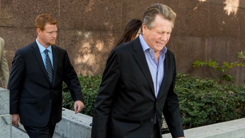 Actor Ryan O'Neal, center, and son, Redmond O'Neal, exit court for a lunch break on Thursday, December 12, 2013, in Los Angles.