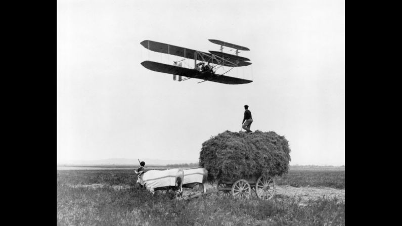 Wilbur Wright flies in Pau, France, in 1908. That year, the Wrights signed a contract with the U.S. Army to provide them with an aircraft that could hold a pilot and passenger while sustaining an hourlong speed of 40 mph.