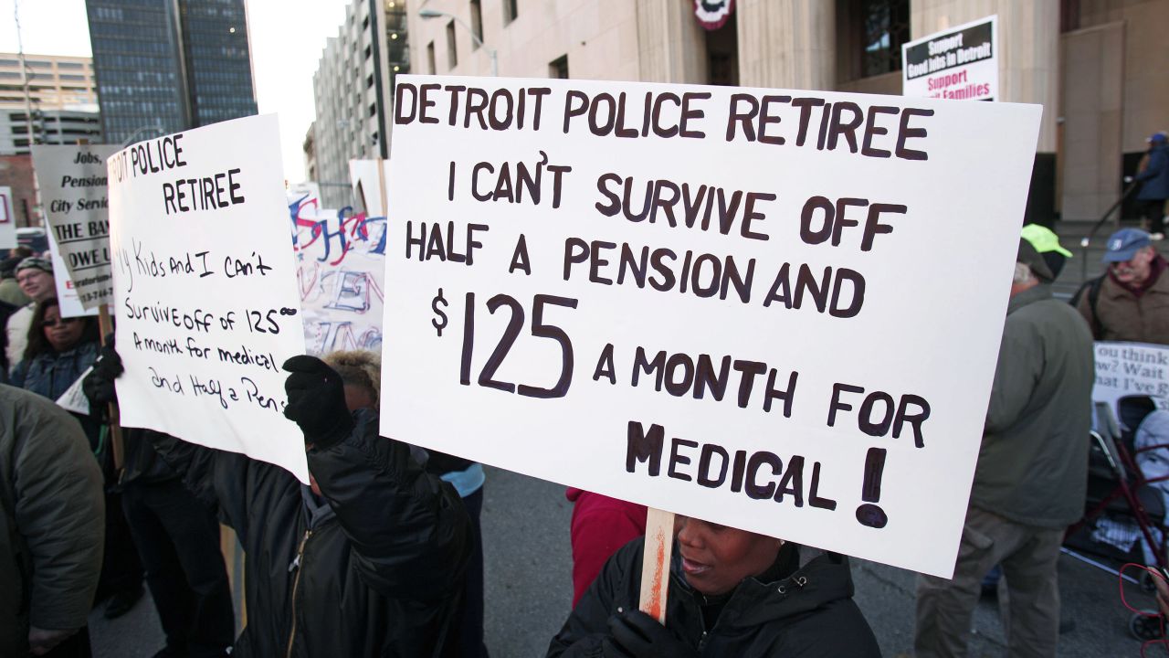 Retired city workers protest in front of the U.S. Courthouse where a judge ruled that Detroit is eligible to file for bankruptcy.