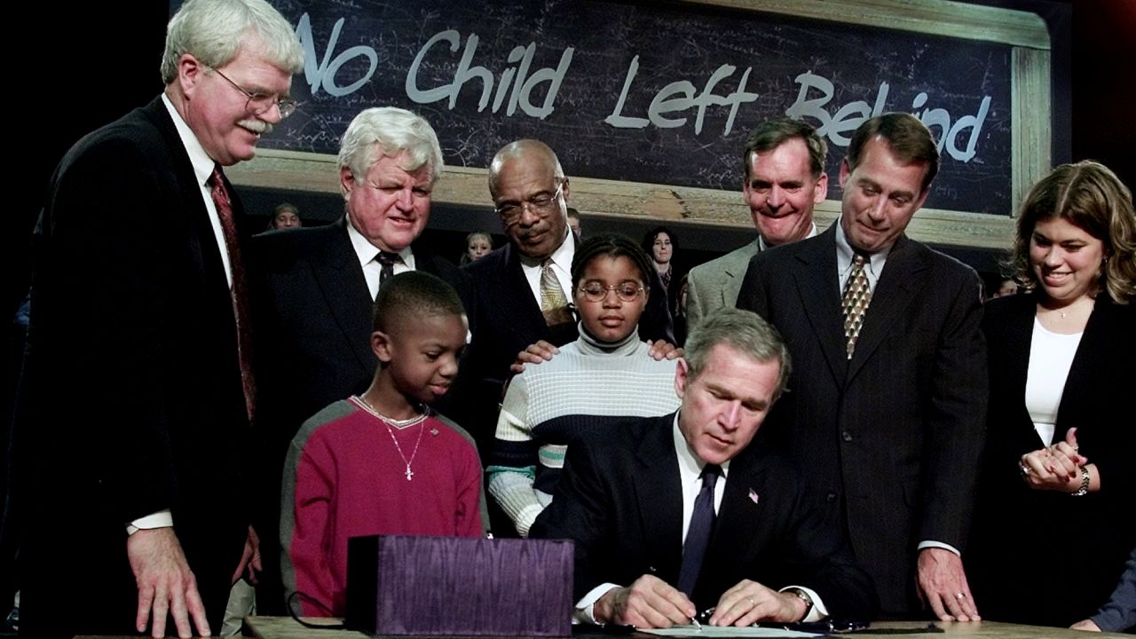 President George W. Bush signs into law the federal education bill No Child Left Behind at a high school in Hamilton, Ohio, in 2002. The law offered the promise of improved schools for the nation's poor and minority children and better-prepared students in a competitive world. Boehner, second from right, backed the bill.