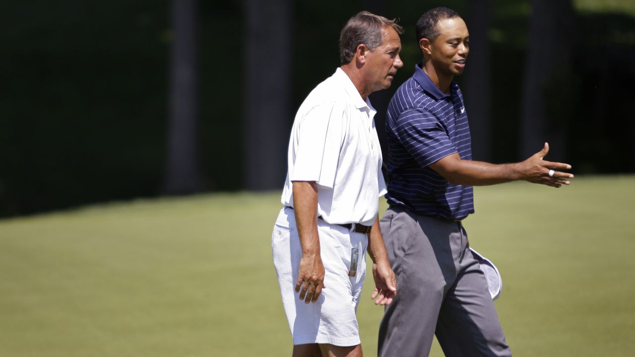 Boehner, an avid golfer, talks with Tiger Woods while golfing at the Congressional Country Club in Bethesda, Maryland, in 2009.