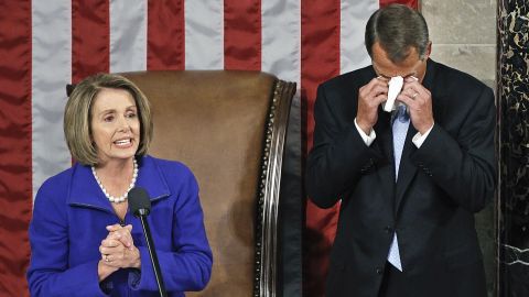 On January 5, 2011, Boehner wipes away tears as he waits to receive the gavel from outgoing House Speaker Nancy Pelosi, D-California, during the first session of the 112th Congress.